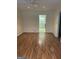 Spacious living room with updated floors that leads to an open kitchen at 8660 Bowden St, Douglasville, GA 30134