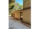View of a side entrance, brick exterior, and a detached garage/carport area at 8660 Bowden St, Douglasville, GA 30134