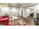 Finished basement features hardwood floors, recessed lights, and a red leather sofa at 8710 Gilmer Ft, Cumming, GA 30028