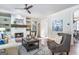 Cozy living room with fireplace, built-in shelves, and comfortable seating area at 8710 Gilmer Ft, Cumming, GA 30028