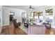 Spacious living room with hardwood floors, view to the kitchen, and neutral tones at 8710 Gilmer Ft, Cumming, GA 30028
