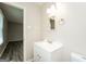 Bright bathroom with vanity, a framed mirror, a modern light fixture and grey flooring at 543 Tahoe Cir, Stone Mountain, GA 30083