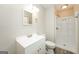 Bathroom with white vanity, framed mirror, and walk-in shower with white surround at 543 Tahoe Cir, Stone Mountain, GA 30083