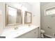Bathroom featuring dual sinks, framed mirrors, and modern fixtures at 543 Tahoe Cir, Stone Mountain, GA 30083