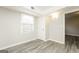 Bedroom with grey flooring, white trim, and a window with natural light at 543 Tahoe Cir, Stone Mountain, GA 30083