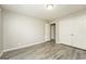 Bedroom featuring neutral paint, wood-look flooring, and a spacious closet at 543 Tahoe Cir, Stone Mountain, GA 30083