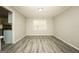 Dining area with new flooring and a large window providing ample natural light at 543 Tahoe Cir, Stone Mountain, GA 30083