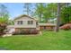 Charming two-story home with brick accents, lush landscaping, and a well-maintained lawn at 543 Tahoe Cir, Stone Mountain, GA 30083