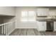 Modern kitchen features white cabinets, granite countertops, and stainless steel appliances at 543 Tahoe Cir, Stone Mountain, GA 30083