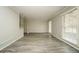 Bright living room with gray walls, new flooring, and natural light from large window at 543 Tahoe Cir, Stone Mountain, GA 30083