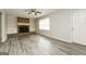 Inviting living room featuring a brick fireplace, built-in shelving, and stylish flooring at 543 Tahoe Cir, Stone Mountain, GA 30083