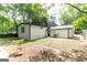 Backyard exterior of home with grass to fence and HVAC system at 6532 Voyles Dr, Riverdale, GA 30274