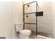 Updated bathroom featuring a tiled shower with black fixtures and a frameless glass enclosure at 6532 Voyles Dr, Riverdale, GA 30274