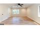 Spacious bedroom featuring wood floors, large windows, and natural lighting at 6532 Voyles Dr, Riverdale, GA 30274