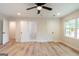 Large bedroom with wood floors, great lighting, and multiple doors at 6532 Voyles Dr, Riverdale, GA 30274