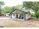 Inviting home featuring a covered front porch and a spacious front yard at 6532 Voyles Dr, Riverdale, GA 30274