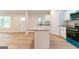 Bright kitchen featuring granite counters, white cabinets, and modern stainless appliances at 6532 Voyles Dr, Riverdale, GA 30274