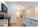 Modern kitchen with granite countertops, stainless steel appliances, and open floor plan at 6532 Voyles Dr, Riverdale, GA 30274