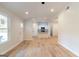 Open living area with wood floors, neutral paint, and ample natural light at 6532 Voyles Dr, Riverdale, GA 30274