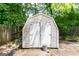 Storage shed with double doors in backyard at 6532 Voyles Dr, Riverdale, GA 30274