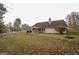A spacious yard with a pergola and patio set, great for entertaining and relaxation at 95 Blue Grass Ct, Oxford, GA 30054