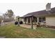 Backyard featuring a patio, pergola-covered seating area and barbecue grill at 95 Blue Grass Ct, Oxford, GA 30054