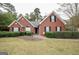 Charming red brick home with well-maintained landscaping and a welcoming entrance at 95 Blue Grass Ct, Oxford, GA 30054