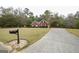 Charming brick home with a well-manicured lawn and a long driveway at 95 Blue Grass Ct, Oxford, GA 30054