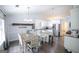 Bright kitchen with stainless steel appliances, white cabinets, an island, and dining space at 95 Blue Grass Ct, Oxford, GA 30054