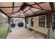 Shaded patio with privacy curtains offers a relaxing outdoor dining or lounging experience at 95 Blue Grass Ct, Oxford, GA 30054