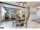 Cozy dining area with a round table, open to the living room and staircase at 1017 Preserve Park Dr, Loganville, GA 30052