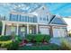 Charming two-story home boasts a well-manicured lawn and inviting curb appeal at 1017 Preserve Park Dr, Loganville, GA 30052