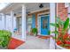 Inviting front porch features brick accents, rocking chairs, and a vibrant blue front door at 1017 Preserve Park Dr, Loganville, GA 30052