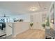 Bright hallway with wood floors, stairs, and stylish decor with an open view to the game room at 1017 Preserve Park Dr, Loganville, GA 30052