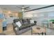 Comfortable living room featuring a large sofa, game machine, ceiling fan, and stylish decor at 1017 Preserve Park Dr, Loganville, GA 30052