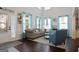Bright living room featuring high ceilings, large windows, and comfortable seating area at 1017 Preserve Park Dr, Loganville, GA 30052