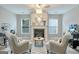 Comfortable living room featuring fireplace and stylish decor with an open concept living space at 1017 Preserve Park Dr, Loganville, GA 30052