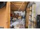 Unfinished basement with exposed ceiling and stored items at 693 Trailwood Dr, Riverdale, GA 30274