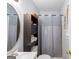 A compact bathroom features a shower with a gray curtain, toilet, and vanity at 693 Trailwood Dr, Riverdale, GA 30274