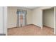 An empty bedroom has neutral walls, wall-to-wall carpeting, and window light at 693 Trailwood Dr, Riverdale, GA 30274