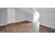 Spacious attic with hardwood floors and a white door at 138 Sam Solomon Rd, Locust Grove, GA 30248