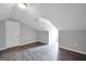 Large attic space with sloping ceilings and a skylight at 138 Sam Solomon Rd, Locust Grove, GA 30248