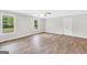 Spacious bedroom with wood floors, neutral walls, and natural light at 138 Sam Solomon Rd, Locust Grove, GA 30248