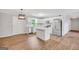 Modern kitchen features white cabinets, stainless steel appliances, and an island at 138 Sam Solomon Rd, Locust Grove, GA 30248