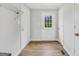 The mud room has three doors and hardwood floors at 138 Sam Solomon Rd, Locust Grove, GA 30248