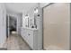 Bright bathroom features a double vanity and a glass-enclosed shower at 614 Highway 85 Conn, Brooks, GA 30205