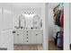 Elegant bathroom featuring double vanities and a walk-in closet at 614 Highway 85 Conn, Brooks, GA 30205