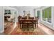 Elegant dining room with a fireplace view, wood table, and stylish decor at 614 Highway 85 Conn, Brooks, GA 30205