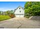 Charming white home with a two-car garage and a beautifully landscaped yard, offering a serene setting at 614 Highway 85 Conn, Brooks, GA 30205