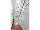 Bright foyer features a skylight, hardwood floors, staircase and a cozy bench at 614 Highway 85 Conn, Brooks, GA 30205